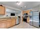 Stylish kitchen with stainless steel appliances and granite countertops at 1171 Pine Acre Dr, Sugar Hill, GA 30518