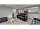Spacious living room with comfortable furniture, hardwood floors, and an open layout at 1171 Pine Acre Dr, Sugar Hill, GA 30518