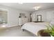 Cozy bedroom featuring neutral decor, a comfortable bed, and an ensuite bathroom with a glass-enclosed shower at 408 Niles Ct, Marietta, GA 30060