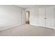 Bedroom featuring neutral carpet, closet and a door, offering ample space at 408 Niles Ct, Marietta, GA 30060