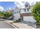 Charming townhome exterior showcasing a blend of brick and siding, complemented by well-manicured landscaping at 408 Niles Ct, Marietta, GA 30060