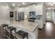Bright kitchen with white cabinets, stainless steel appliances, granite countertops, and hardwood flooring at 408 Niles Ct, Marietta, GA 30060