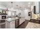 Open-concept kitchen boasts a granite island, stainless steel appliances, and seamless flow to the living area at 408 Niles Ct, Marietta, GA 30060