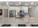 Kitchen featuring a large island with granite countertop, pendant lights, and stainless steel appliances at 408 Niles Ct, Marietta, GA 30060