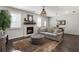 Stylish living room with hardwood floors, fireplace, and large windows that flood the space with natural light at 408 Niles Ct, Marietta, GA 30060
