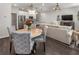 Open concept living area with hardwood floors seamlessly connects living, dining, and kitchen spaces for a comfortable home flow at 408 Niles Ct, Marietta, GA 30060