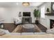 Cozy living room with hardwood floors, a gray entertainment center, and lots of natural light that make the space inviting at 408 Niles Ct, Marietta, GA 30060