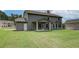 Expansive backyard with a covered patio that includes ample space for outdoor activities at 600 Sidney Ct, Stockbridge, GA 30281