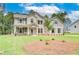 Well-designed home featuring a mix of brick and siding and landscaped front yard at 600 Sidney Ct, Stockbridge, GA 30281