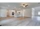 Open-concept living area with hardwood floors adjacent to kitchen with island and modern appliances at 600 Sidney Ct, Stockbridge, GA 30281