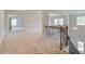 Bright loft area with decorative railing, providing an open and airy transition between floors at 600 Sidney Ct, Stockbridge, GA 30281