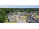 Aerial view of a new neighborhood with tree-lined streets and a scenic backdrop at 1005 Coleman Place Dr, Roswell, GA 30075