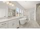 Bright bathroom with a large tub, double vanities, and a separate glass shower at 1005 Coleman Place Dr, Roswell, GA 30075