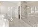 Modern bathroom featuring a glass shower with gray tile and contrasting floor tiles at 1005 Coleman Place Dr, Roswell, GA 30075