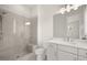 Sleek bathroom featuring a glass-enclosed shower, modern fixtures, and a vanity with ample counter space at 1005 Coleman Place Dr, Roswell, GA 30075