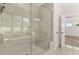Glass enclosed shower with tile and bench seating at 1005 Coleman Place Dr, Roswell, GA 30075
