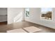 Bedroom featuring hardwood floors and windows and open door to closet at 1005 Coleman Place Dr, Roswell, GA 30075