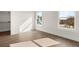 Bedroom with hardwood floors, natural light, and closet at 1005 Coleman Place Dr, Roswell, GA 30075