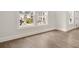 Bright bedroom space with hardwood floors and a view of the outdoors at 1005 Coleman Place Dr, Roswell, GA 30075