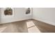 Bedroom featuring hardwood floors and windows showing a view outside at 1005 Coleman Place Dr, Roswell, GA 30075