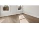 Bedroom with hardwood floors and natural light from windows at 1005 Coleman Place Dr, Roswell, GA 30075