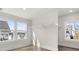 Bright walk-in closet featuring hardwood floors and a clothing rack at 1005 Coleman Place Dr, Roswell, GA 30075