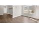 Spacious walk-in closet featuring hardwood floors, a window, and clothing racks at 1005 Coleman Place Dr, Roswell, GA 30075