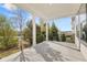 Covered patio featuring stately columns, recessed lighting, and backyard view at 1005 Coleman Place Dr, Roswell, GA 30075