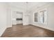Dining room with hardwood floors, large windows, and custom butler's pantry at 1005 Coleman Place Dr, Roswell, GA 30075