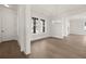 Spacious dining room featuring hardwood floors, stylish lighting, and elegant trim at 1005 Coleman Place Dr, Roswell, GA 30075