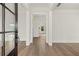 Open-concept entryway featuring hardwood floors, white trim, and transom window at 1005 Coleman Place Dr, Roswell, GA 30075