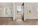 Welcoming foyer with hardwood floors and view to the street at 1005 Coleman Place Dr, Roswell, GA 30075