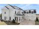 A spacious two-story home with attached garage and gray siding at 1005 Coleman Place Dr, Roswell, GA 30075