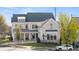 Beautiful two-story home with gray siding, dark roof, well-maintained landscaping, and inviting curb appeal at 1005 Coleman Place Dr, Roswell, GA 30075