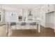 Spacious white kitchen with island, quartz countertops, and stainless steel appliances at 1005 Coleman Place Dr, Roswell, GA 30075