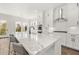 Modern kitchen with white cabinets, stainless steel appliances, and quartz countertop island at 1005 Coleman Place Dr, Roswell, GA 30075