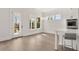 Bright kitchen and breakfast area, with an island, stainless appliances, and access to the outdoor living space at 1005 Coleman Place Dr, Roswell, GA 30075