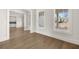 Open living room with hardwood floors and two large windows providing natural light at 1005 Coleman Place Dr, Roswell, GA 30075