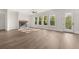 This living room features a modern fireplace, many windows, and lovely light at 1005 Coleman Place Dr, Roswell, GA 30075