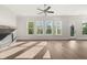 Bright, airy living room with a fireplace, large windows, and contemporary design at 1005 Coleman Place Dr, Roswell, GA 30075