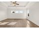 Spacious main bedroom with tray ceilings and large windows for ample natural light at 1005 Coleman Place Dr, Roswell, GA 30075