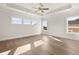 Spacious main bedroom with tray ceilings and large windows for ample natural light at 1005 Coleman Place Dr, Roswell, GA 30075