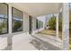 Covered outdoor patio with concrete flooring, offering a great space for relaxation and outdoor enjoyment at 1005 Coleman Place Dr, Roswell, GA 30075