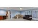 Spacious finished basement with a small bar, a couch and many boxes at 2365 Valley Mill Dr, Buford, GA 30519