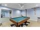 Basement game room with a pool table, bar stools, and views to another room at 2365 Valley Mill Dr, Buford, GA 30519