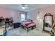 Pink bedroom with natural light, carpet floors, and ample storage at 2365 Valley Mill Dr, Buford, GA 30519