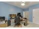 Spacious bedroom with light blue walls, a ceiling fan, and a neutral carpet at 2365 Valley Mill Dr, Buford, GA 30519