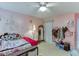 Bright bedroom featuring a castle wall decal, plush bedding, and charming decor elements at 2365 Valley Mill Dr, Buford, GA 30519