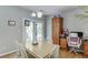 Bright dining area with hardwood floors, white table, and access to the outdoor deck at 2365 Valley Mill Dr, Buford, GA 30519