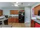 Kitchen with wood cabinets, stainless appliances, and a breakfast bar at 2365 Valley Mill Dr, Buford, GA 30519